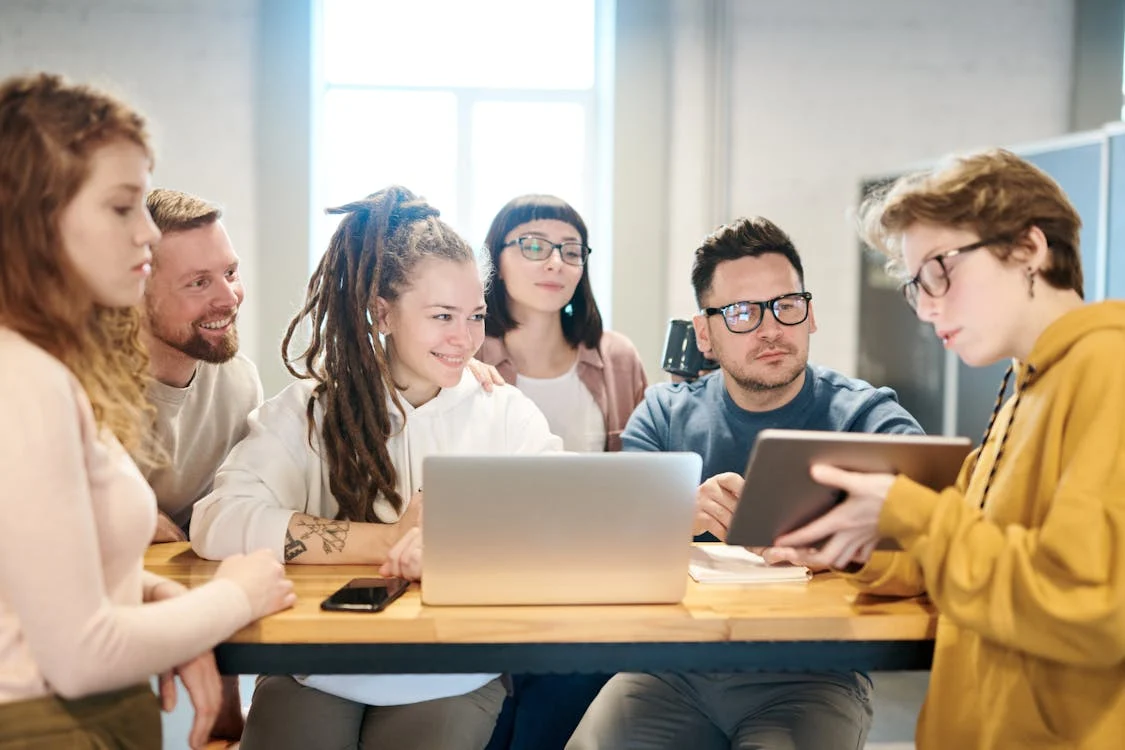 Modern coworking space with people working and collaborating.